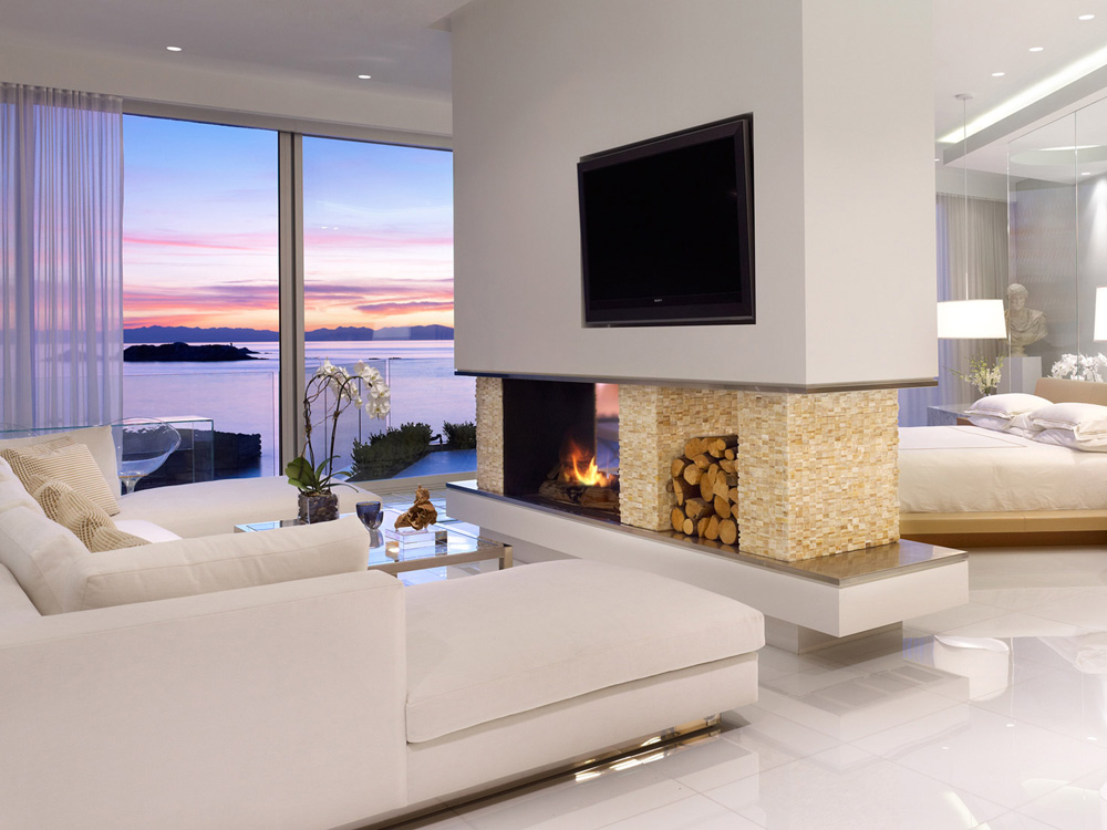 Modern 2 sided fireplace with wood storage